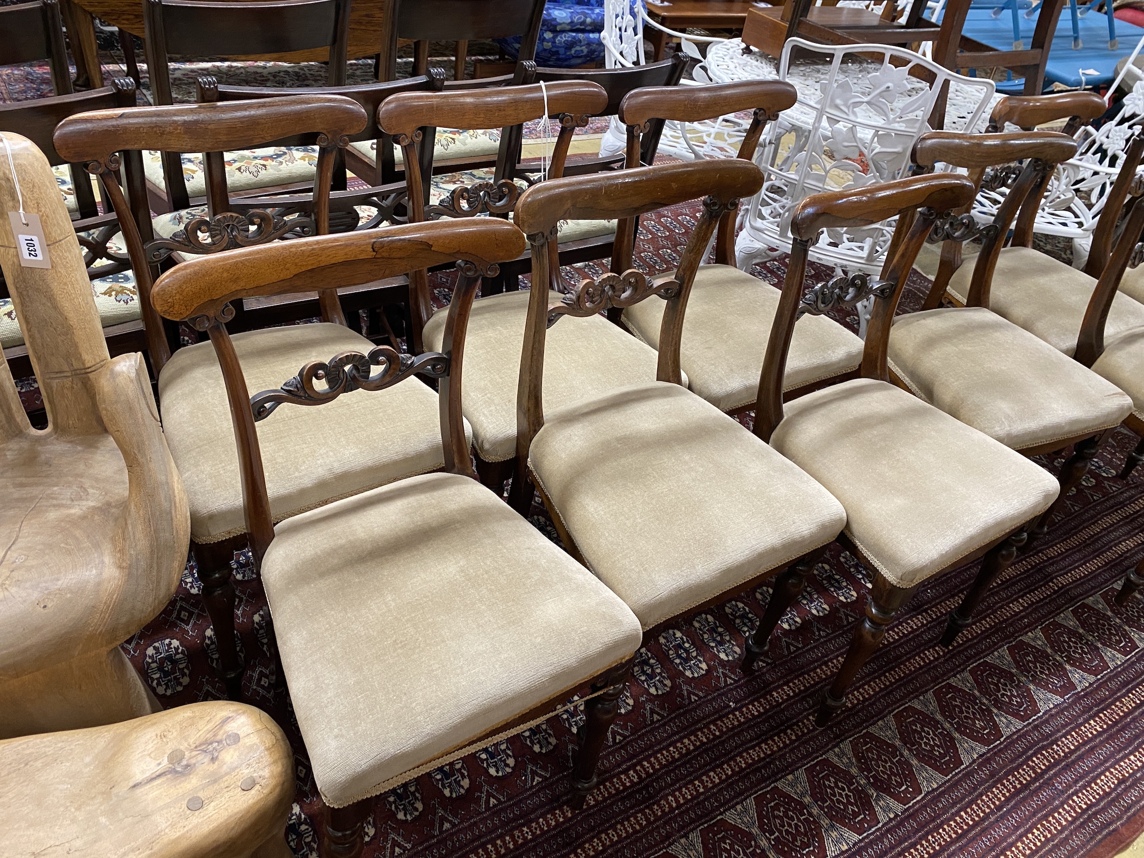 A set of ten early Victorian rosewood dining chairs with upholstered seats, width 44cm, height 82cm